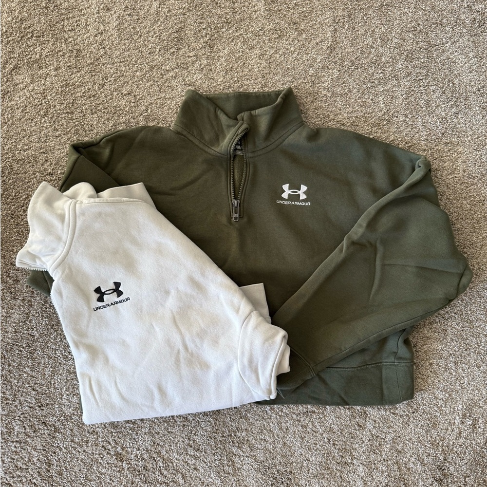 TWO under armour crop quarter zip sweatshirts.